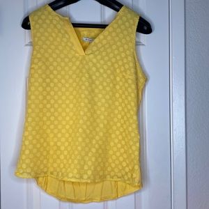 Yellow sleeveless blouse
